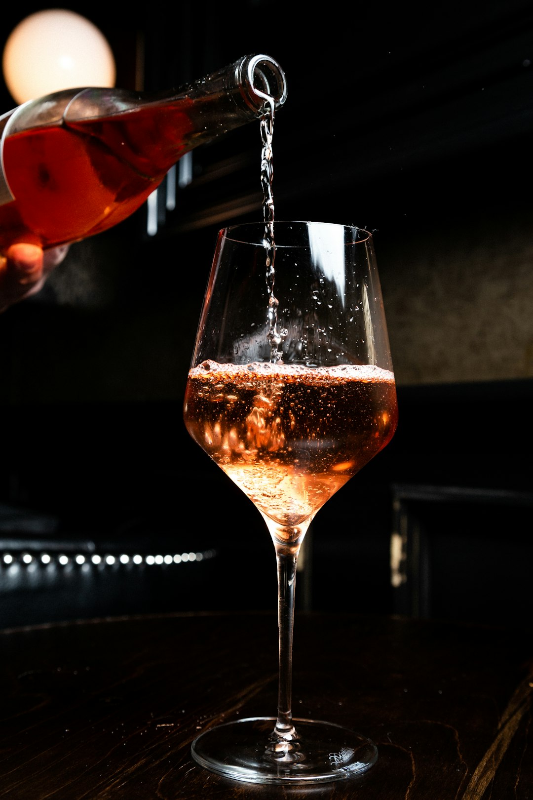 Photo by Kevin Kelly liquor pours in wine glass